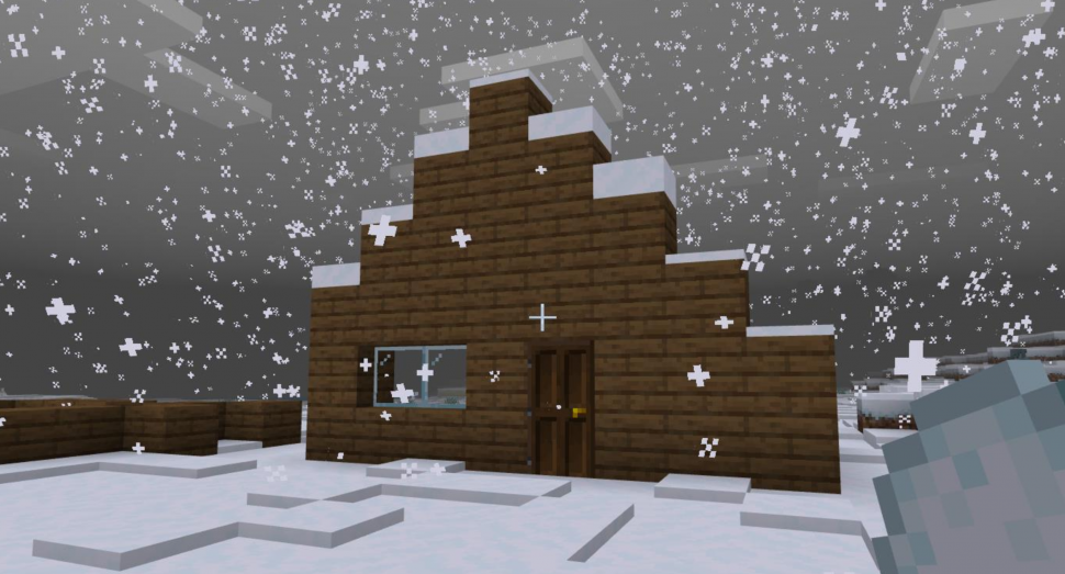 Ett hus med snö på, byggd i Minecraft